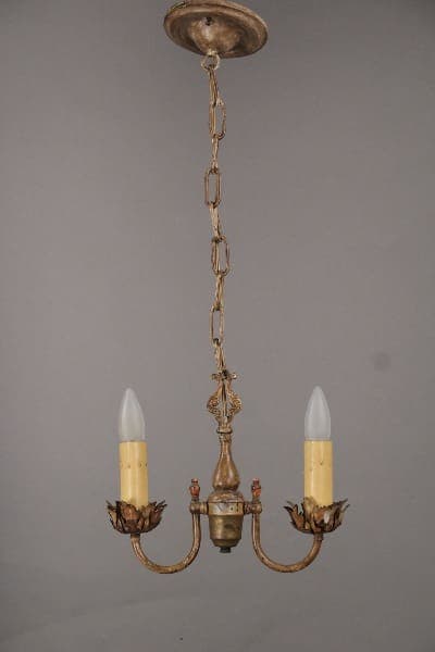10425. 1920's Two Light Pendant With Acanthus Motif with two electric candles, ornate leaf motifs, and a linked chain, mounted against a gray background.
