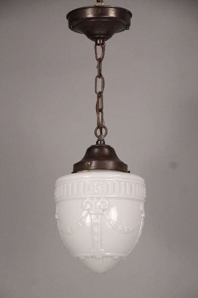 10498. 1930's Glass Pendant With Floral Wreath with ornate designs, suspended by a chain from a bronze-colored fixture.