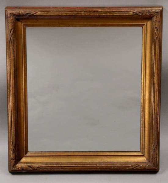 An empty 10607. 1920's Hand Carved Gilt Mirror against a neutral gray background.