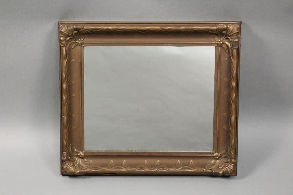10618. Circa 1920's Wood Mirror With Nice Plaster Details with an ornate gold frame featuring intricate scroll and leaf patterns, displayed against a neutral gray background.