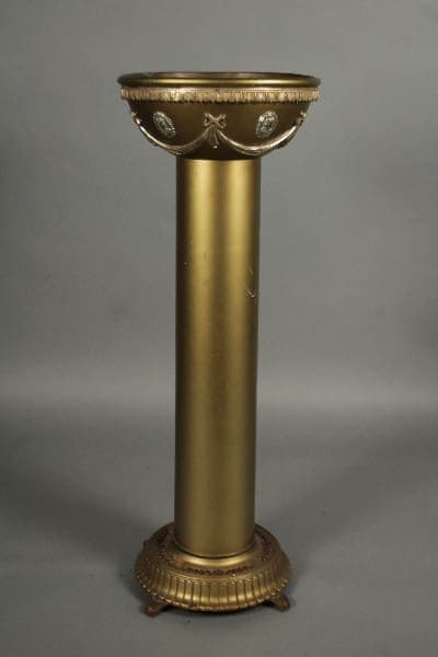 11931. 1920's Spanish Revival Tall Plant Stand with decorative motifs and fluted column, standing against a grey background.
