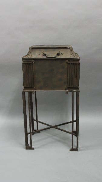 12286. 1930's Tall Iron Ice Chest with a folding top, supported on a slender four-legged stand with crossbars, against a grey backdrop.