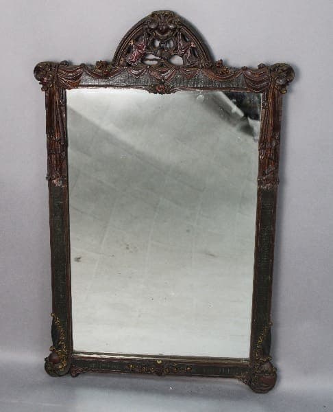 13936. Spanish Revival Polychrome Mirror with a decorative floral and scrollwork frame, showing signs of wear and tarnish.