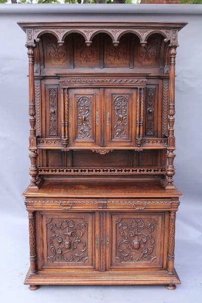 Antique 13958. Carved Walnut Court Cabinet with ornate carvings and multiple shelves, set against a neutral backdrop.