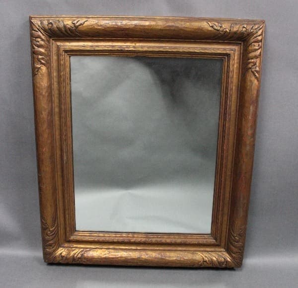 Ornate 14177. 1920's Mirror With New Mirror with an empty gray background on a light gray draped cloth.
