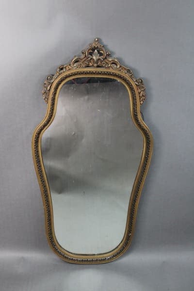 14235. 1920's Mirror With Original Finish with intricate detailing, mounted on a grey background.