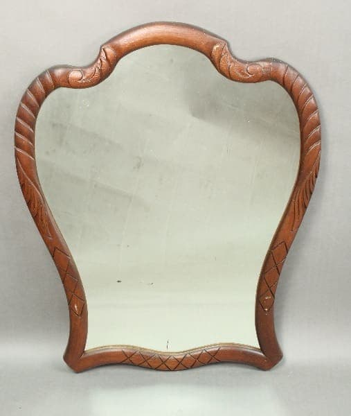 Antique 14435. Spanish Revival Scalloped Mirror with decorative geometric carvings on the frame, set against a plain gray background.