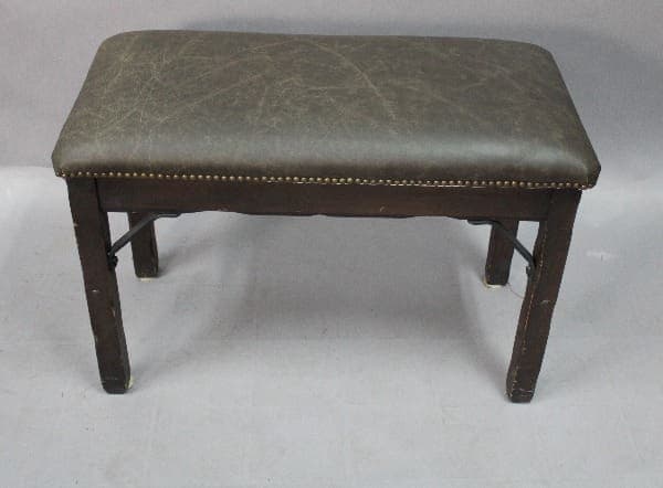 A vintage 15047. Monterey Style Piano Bench with iron bracket and new leather upholstery.