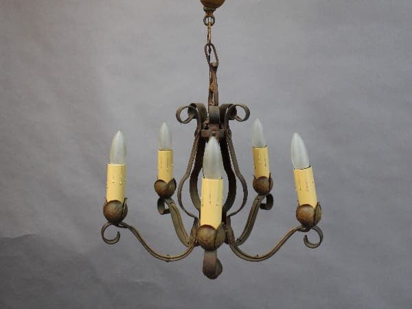 An antique 15381. 1920's Chandelier With Simple Lines with five candle-like bulbs against a gray background.