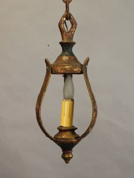 An 15487. Circa 1920's pendant with original finish with a single white bulb enclosed in an oval frame, exhibiting signs of tarnish and wear.