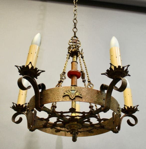 15883. 1920's Polychrome Spanish Revival Chandelier with ornate metalwork and three candle-like bulbs, suspended by a chain.