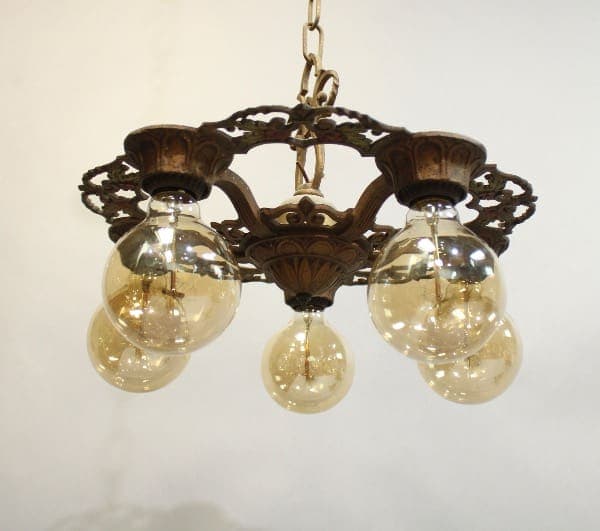 15926. 1920's Five Light Chandelier with three glass globes hanging from a decorative metal frame against a white background.