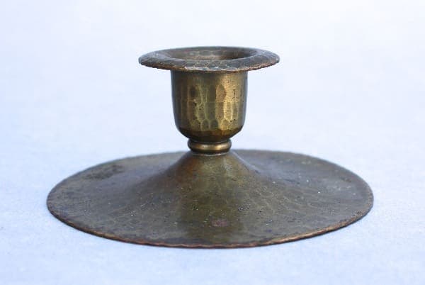 9330. Roycroft Hand Hammered Candle Stick with a wide base and a patina finish, showcasing engraved designs on the cup.