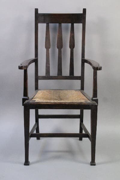 10271. Arts And Crafts Chair With Rush Seat with a high back and woven seat, set against a gray background.