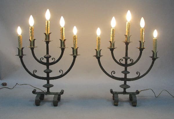 Two 12557. Pair Of 5 Light 1920's Spanish Revival Table Lamps, with multiple lit bulbs, placed symmetrically against a neutral background.