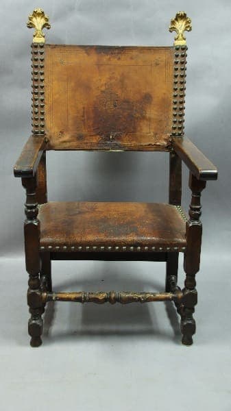 Antique wooden chair with ornate details.