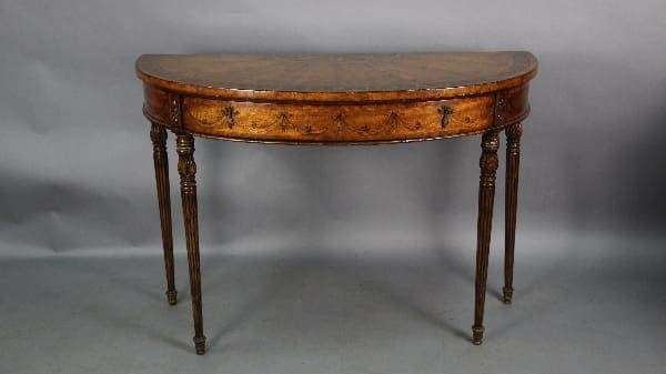 Antique 13125. 19th Century Demi Lune Table with Inlay console table with floral inlay and tapered legs, displayed against a gray backdrop.
