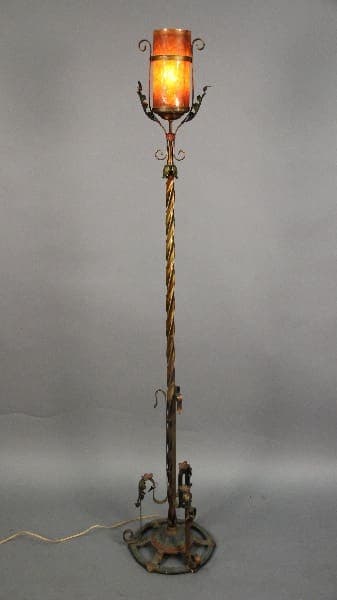 Antique floor lamp with ornate design.