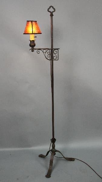 Vintage floor lamp with orange shade.