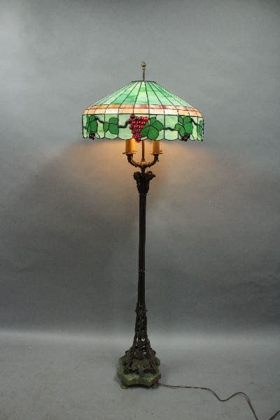 Stained glass floor lamp with grape design.