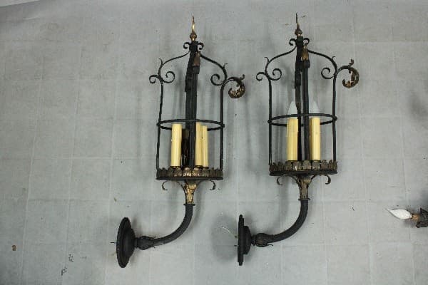 Elegant wall sconces with candle holders.