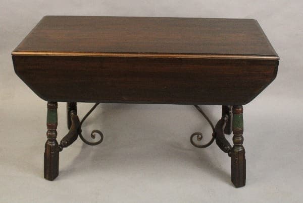 Antique 15179. Circa 1920's Dining Room Table with curved metal legs and green and red accents on the legs.