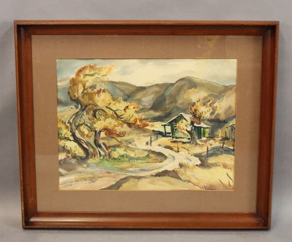 Framed watercolor landscape with a small house.