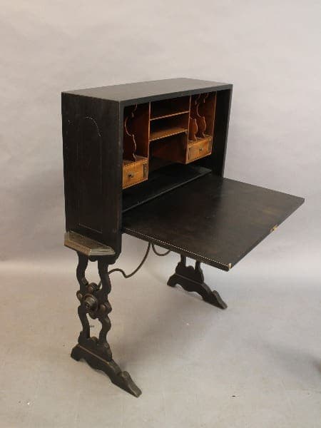15378. Spanish Revival 1920's Writing Desk with an open writing surface, multiple compartments, and ornate metal legs on a plain background.