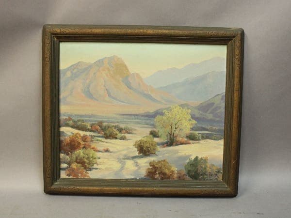 Mountain landscape painting with framed artwork.