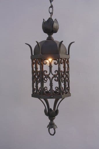 Decorative hanging lantern with intricate design.