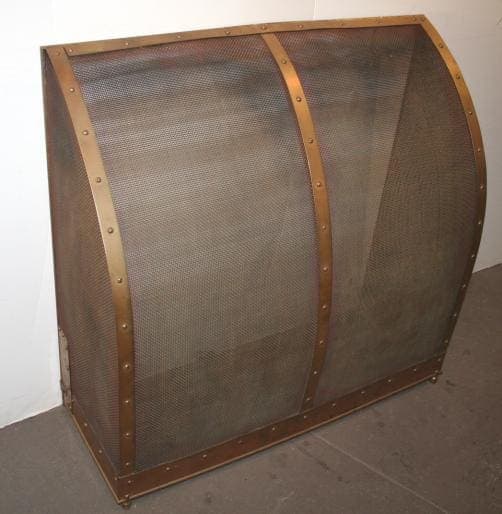 A large, curved, 994. Free Standing Fireplace Screen secured with horizontal wooden strips and metallic rivets, displayed against a plain wall and floor.