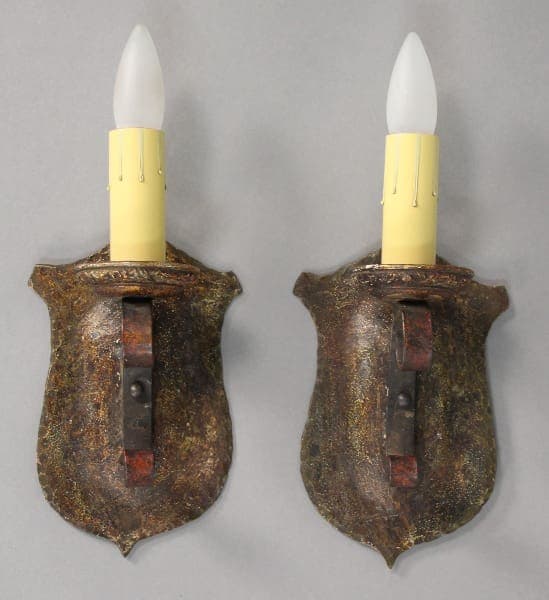 Two vintage wall sconces with bulbs.