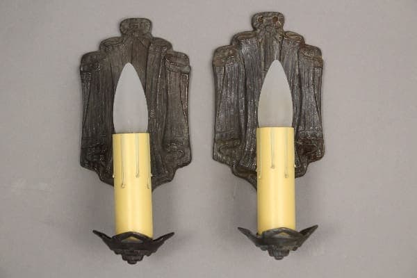Vintage wall sconces with candle-like bulbs.