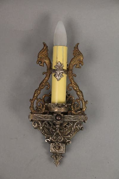 Ornate candle holder with decorative elements.