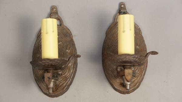 Vintage wall sconces with yellow candles.