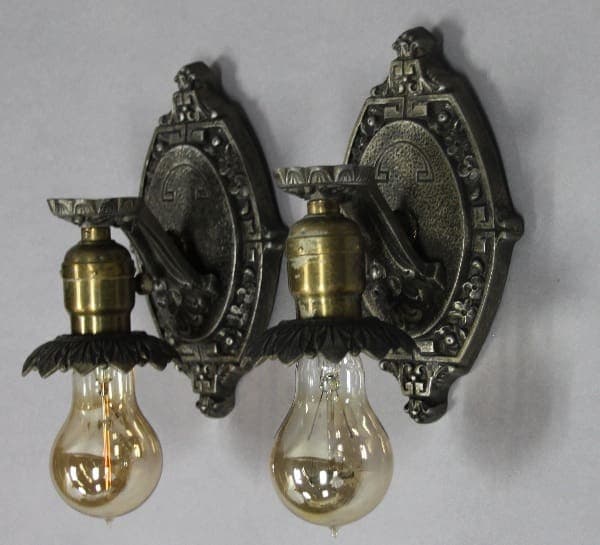 Vintage wall sconces with decorative bulbs.