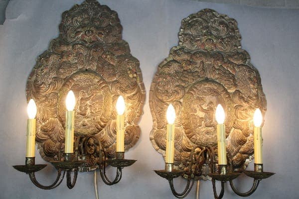 Ornate candle wall sconces with lights.