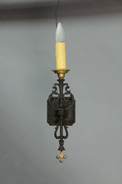 Vintage wall sconce with candle holder.