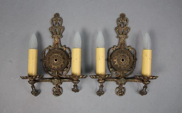 Vintage wall sconces with candle-shaped bulbs.