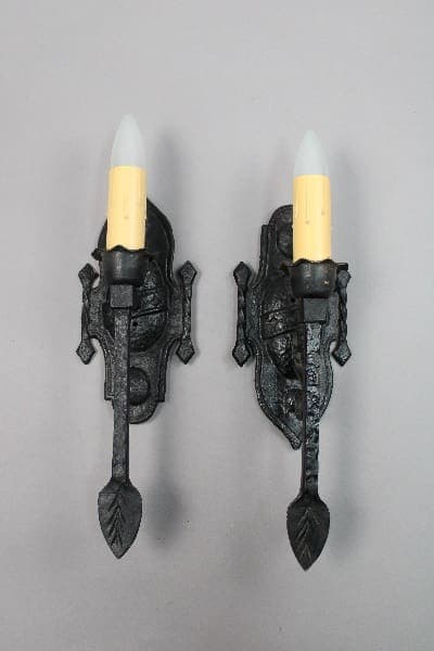 Vintage wall sconces with candle-like bulbs.