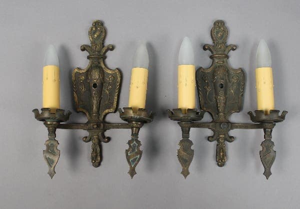 Vintage wall sconces with candle-like bulbs.
