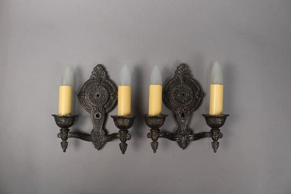 Vintage wall sconce with candle-like lights.