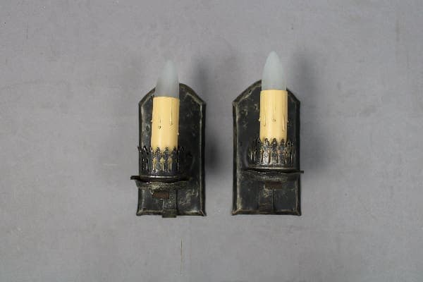 Vintage wall sconces with faux candles.