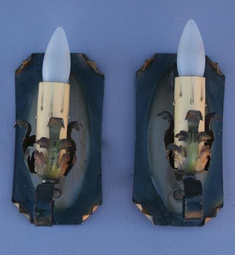 Vintage wall sconces with frosted bulbs.
