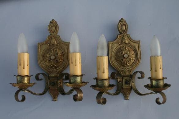 Vintage wall sconces with candle-like lights.