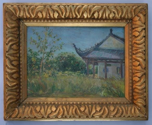Framed painting of a serene landscape.