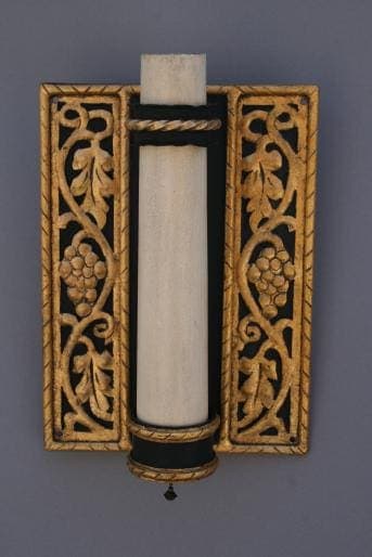 Ornate wall sconce with grapevine design.