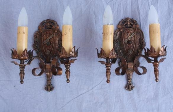 Vintage wall sconces with candle-like bulbs.