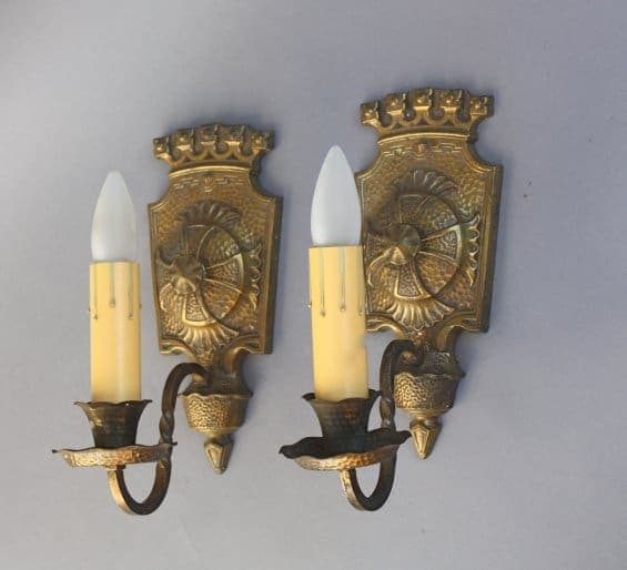 Vintage wall sconces with candle-like bulbs.