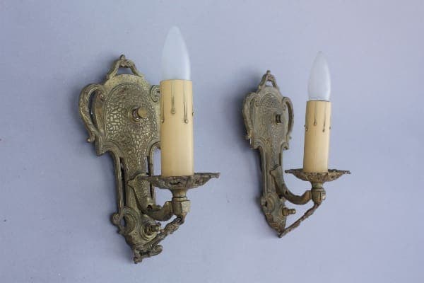 Vintage wall sconces with candle-like bulbs.